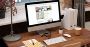 Schreibtisch mit iMac mit Website von Cartida