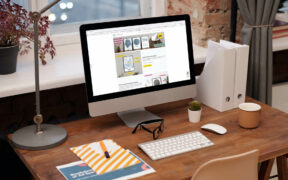 Schreibtisch mit iMac mit Website von Cartida